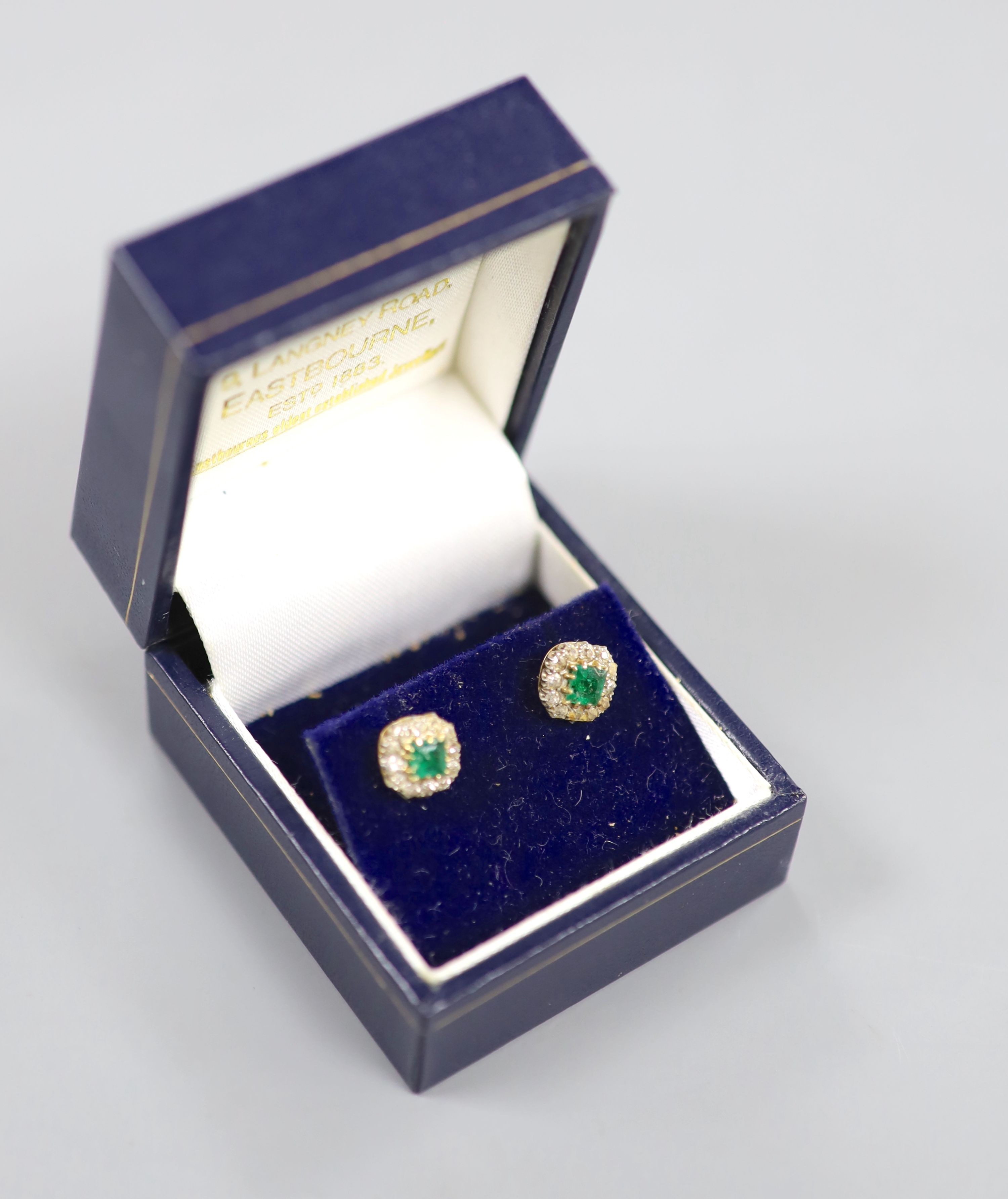 A pair of 18ct, emerald and diamond set octagonal cluster ear studs, 8mm, gross weight 3.2 grams.